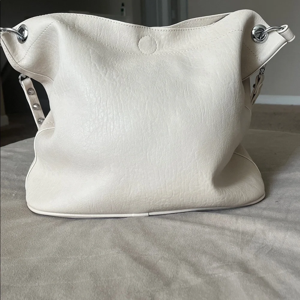Madison West Purse in a purse
Cream purse w/ silver details. - Picture 2 of 6